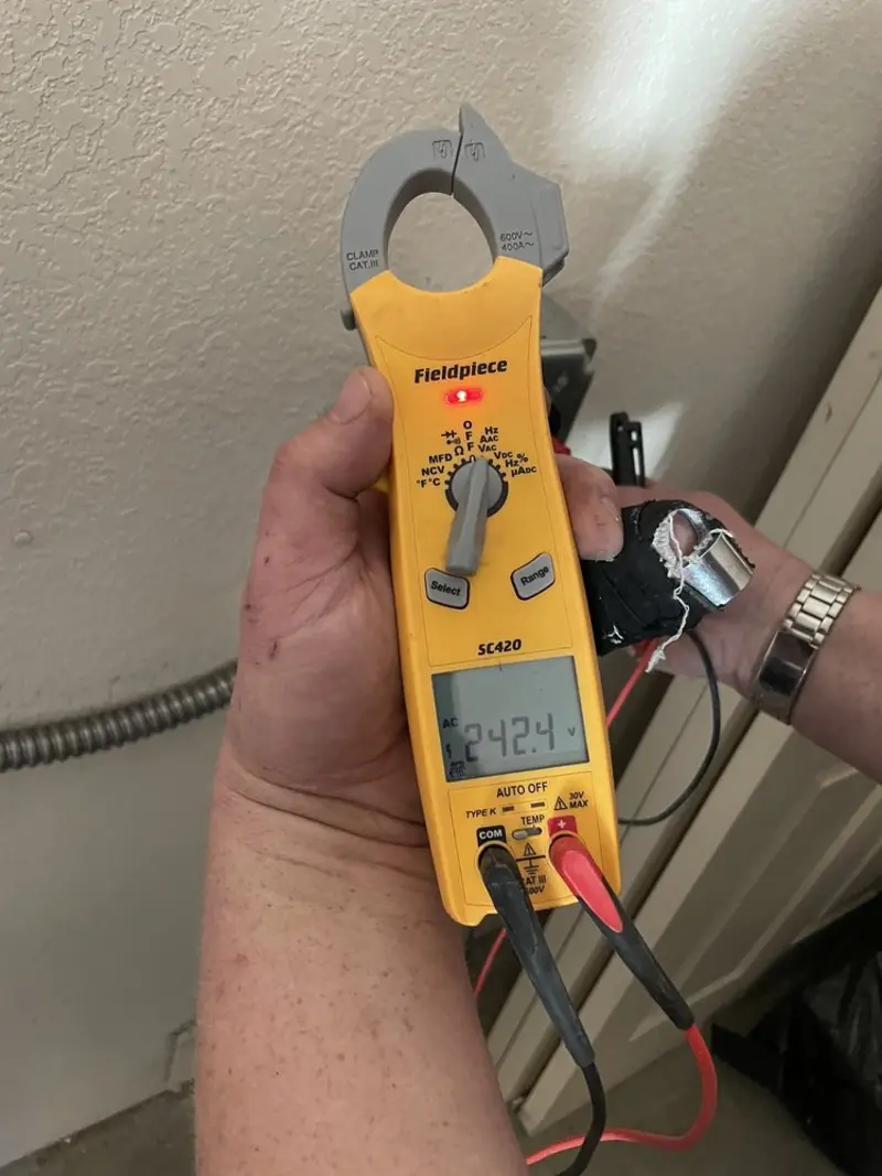 Voltage testing with clamp meter during Electrical Installation Services in Perinton